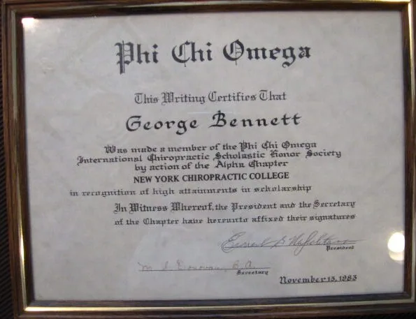 Framed certificate from Phi Chi Omega certifying George Bennett as a member of the International Chiropractic Scholastic Society from New York Chiropractic College, dated November 13, 1928.